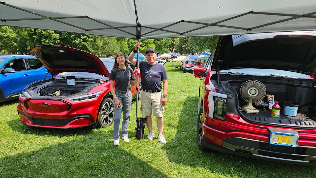 rhoda and rick eisenberg with mustang mach e and ford f150 lightning.jpg