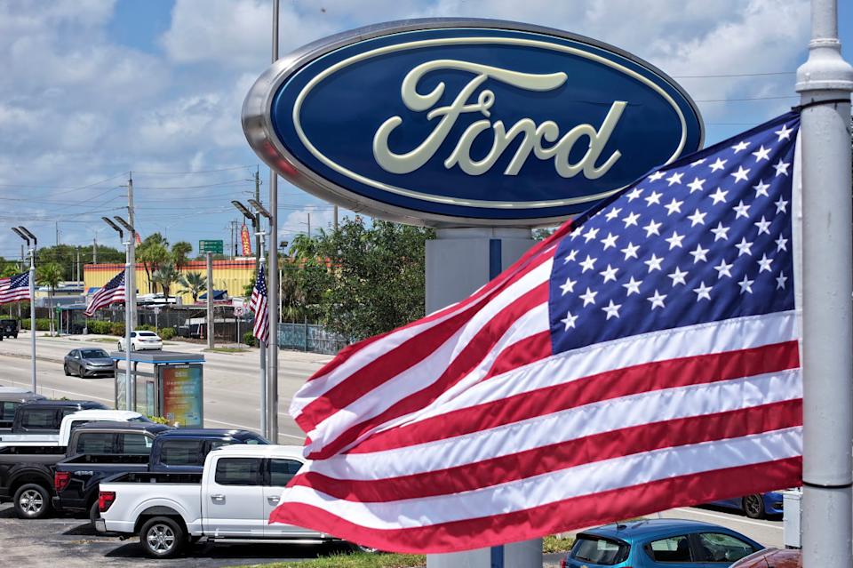 Ford dealer logo behind the US flagGetty Images
