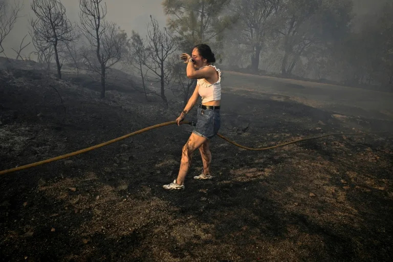 Spain suffers third wildfire death, Greece beats back flames