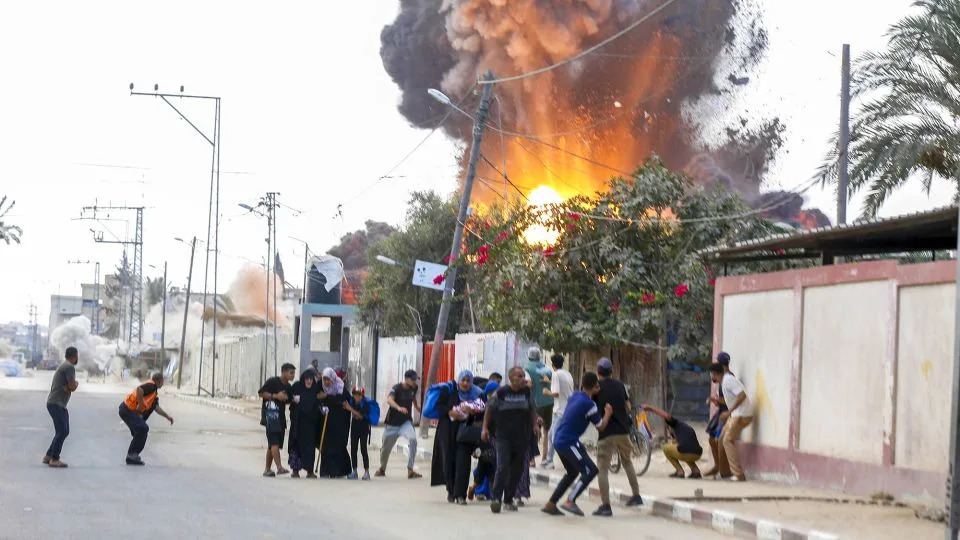 Palestinians rush to escape the area after Israeli warplanes' bomb strike on the tents where displaced Palestinians live in Deir al Balah, Gaza on Thursday. - Anadolu/Getty Images