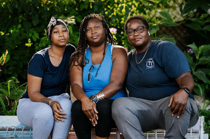 From left: Bonita Scott, 20, Christina Monroe, 35 and Tasha Monroe, 38, at the Transgender Memorial Garden on Tuesday, July 1, 2025, in south St. Louis.