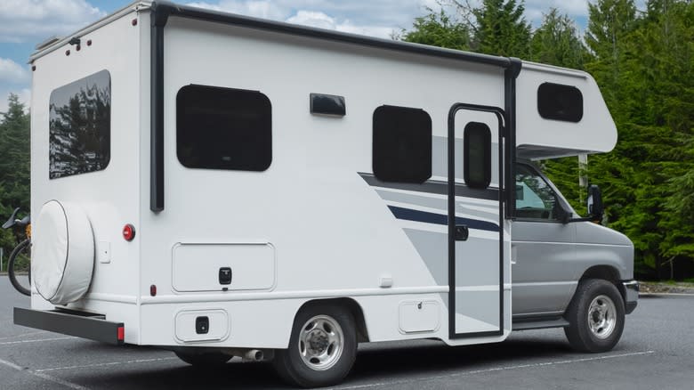 A white RV in a parking spot