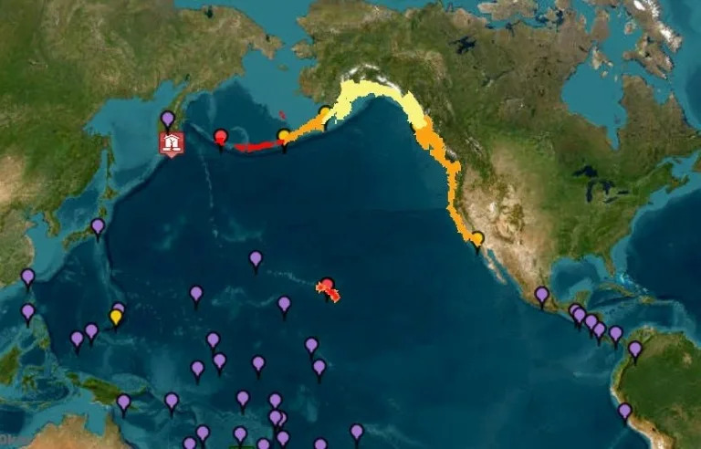 This image courtesy of the National Oceanic and Atmospheric Administration's Tsunami Warning System shows tsunami warnings (red), advisories (orange) watches (yellow) and threats (purple) after an 8.7 earthquake hit off of Russia's far east (-)