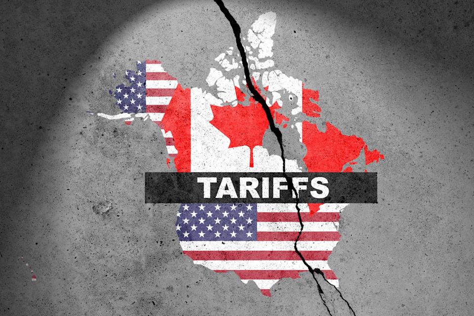 canada and usa flags map painted on the concrete wall with word tariffs. duty, trade, customs and tariffs war
