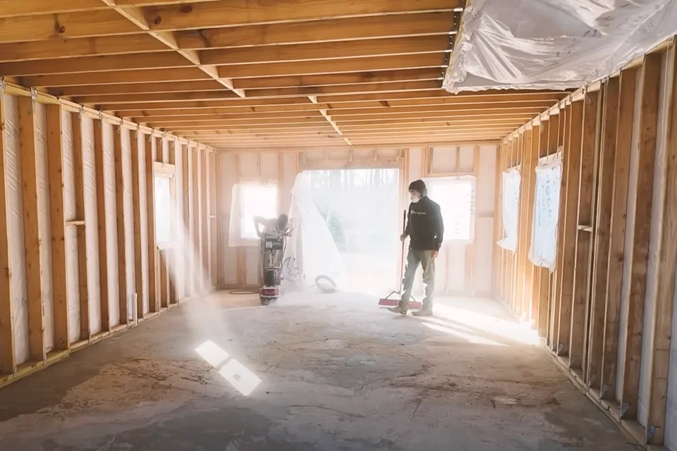 A frame house under construction at Return to the Land's Arkansas site (Aarvoll/YouTube)