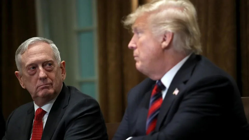 In this October 2018 photo, then-US Defense Secretary Jim Mattis listens as then-President Donald Trump answers questions during a meeting with military leaders in the Cabinet Room in Washington, DC. - Win McNamee/Getty Images/File