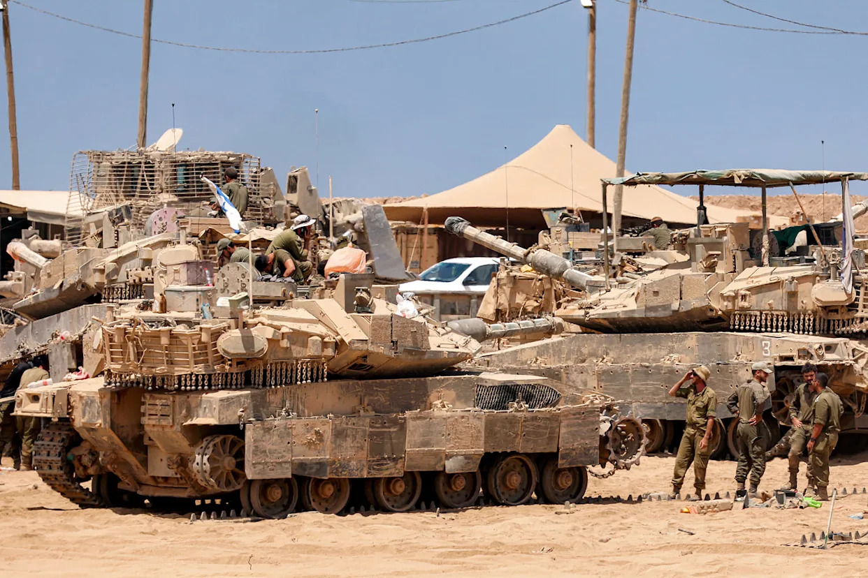 Satellite images show Israel building up forces for a possible ground invasion of Gaza, sources say