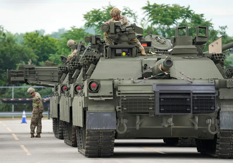 Soldiers from the 1st Armored Brigade Combat Team, 1st Cavalry Division from U.S. Army Fort Cavazos work to offload and ready United States Army M1A2 Abrams Main Battle Tanks, M2 Bradley Fighting Vehicles and M109A6 Paladin American 155mm Self-Propelled Howitzers on June 9, 2025.