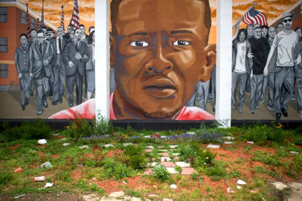  A mural memorializing Freddie Gray, whose death in police custody in 2015, sparked an upheaval in Baltimore politics, policing and public life. (Photo by Mark Makela/Getty Images)