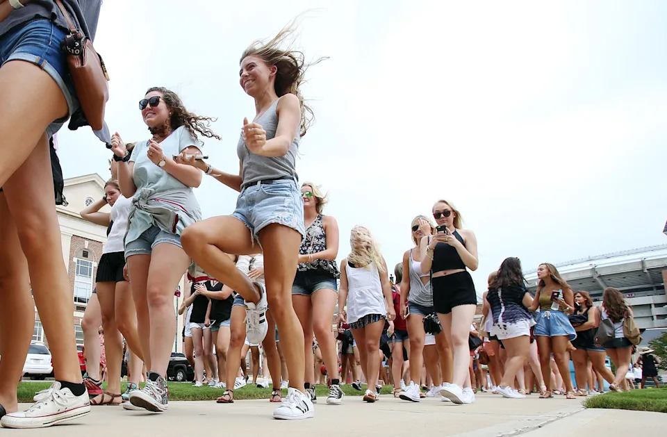 Young women make their way to the parking deck on Sorority Row before receiving bids during the University of Alabama's Formal Sorority Recruitment Bid Day on Sorority Row in Tuscaloosa, Ala. on Saturday, Aug. 13, 2016. More than 2,600 students participated in recruitment, with the largest recruitment class in the nation, and 2,488 received bids from the 16 participating Panhellenic sororities.  Staff Photo/Erin Nelson