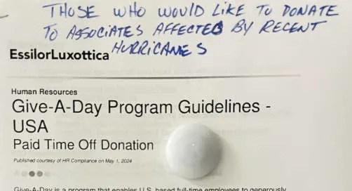 Sign about donating paid time off to help associates affected by recent hurricanes, titled "Give-A-Day Program Guidelines - USA."