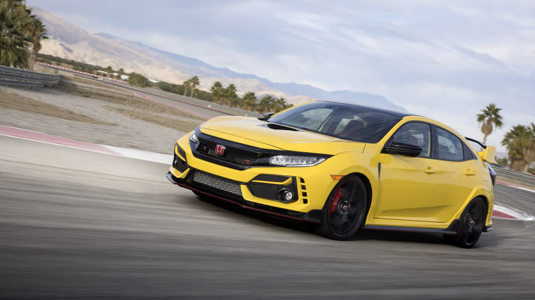 A yellow Honda Civic Type R