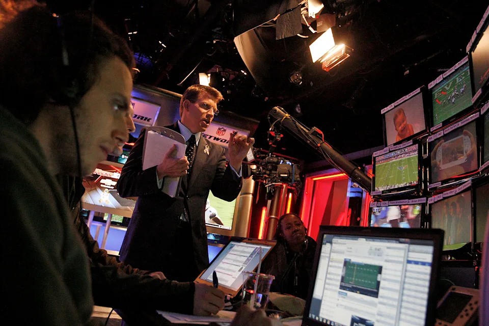 Host Scott Hanson (middle) and NFL RedZone have changed the way we can watch football on Sundays. (Photo by Gary Friedman/Los Angeles Times via Getty Images)