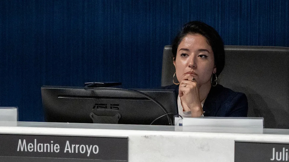 Lenexa City Council member Melanie Arroyo listens to public Leon Patton comment on immigration enforcement during an Aug. 19, 2025, city council meeting