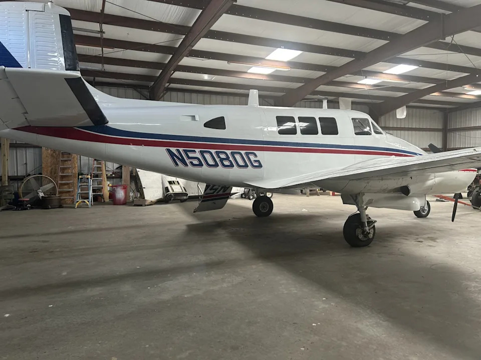 A 1964 Queen Air is stored in a hangar at the Evans County Airport.