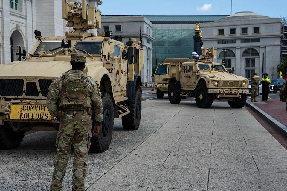 Members of the D.C. National Guard position their Oshkosh M-ATV vehicles as they arrive at Union Station on Aug. 15, 2025, in Washington, D.C.  / Credit: Getty Images