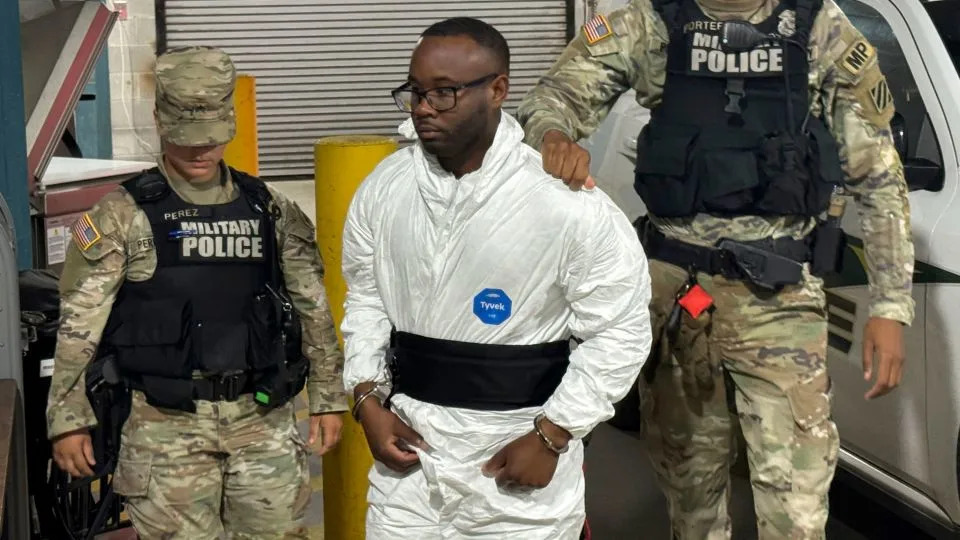 Sgt. Quornelius Radford was escorted by military police into a booking room at the Liberty County Jail in Hinesville, Georgia on August 6. - Lewis M. Levine/AP