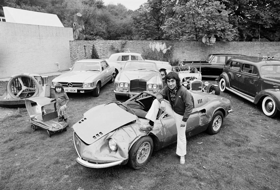 drummer keith moon (1947 1978), of british rock group the who at tara, his home in chersey, surrey, with his daughter, amanda (left), and some of the cars in his collection, 17th october 1972. moon is sitting on a damaged ferrari dino. (photo by jack kay/daily express/hulton archive/getty images)