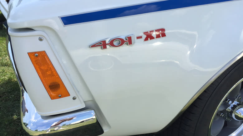 The front left fender of a white 1972 AMC Gremlin 401-XR