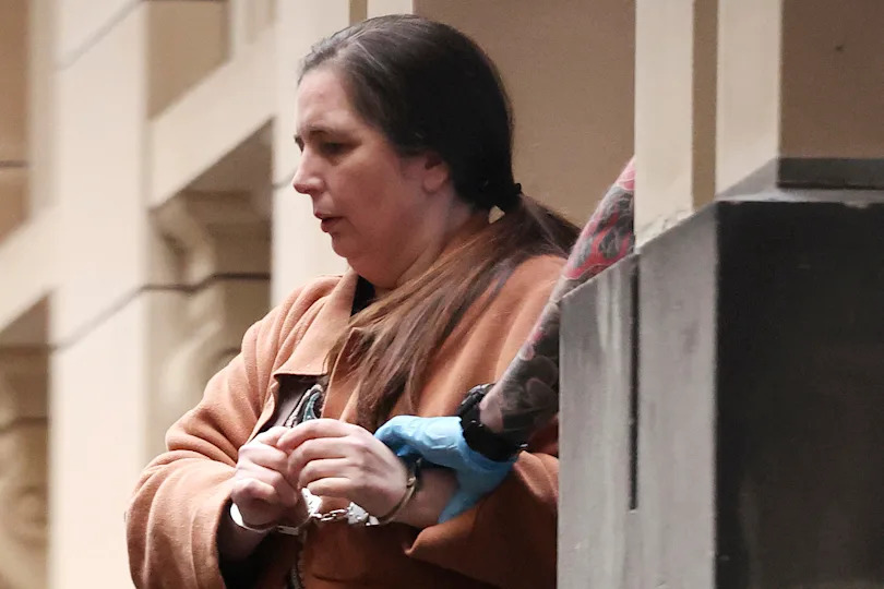 Convicted murderer Erin Patterson is escorted out of the Supreme Court of Victoria following the day's proceedings in a pre-sentencing hearing in Melbourne on August 25, 2025. / Credit: MARTIN KEEP / AFP via Getty Images