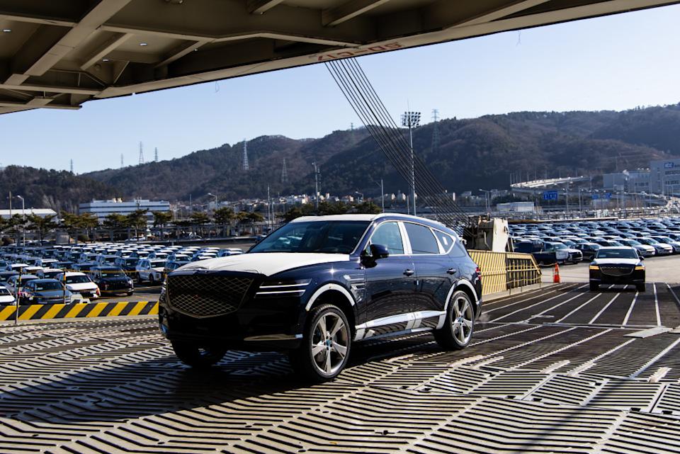 Hyundai Motor Co. Genesis GV 80 sport utility vehicles (SUV) bound for export are driven into the Hyundai Glovis Co. roll-on/roll-off (RORO) vehicles carrier cargo shipSeongJoon Cho/Bloomberg via Getty Images
