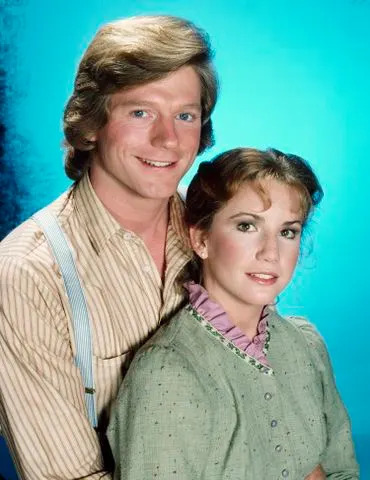 Herb Ball/NBCU Photo Bank/NBCUniversal via Getty Dean Butler (left) and Melissa Gilbert as Almanzo Wilder and Laura Ingalls Wilder on 'Little House on the Prairie'