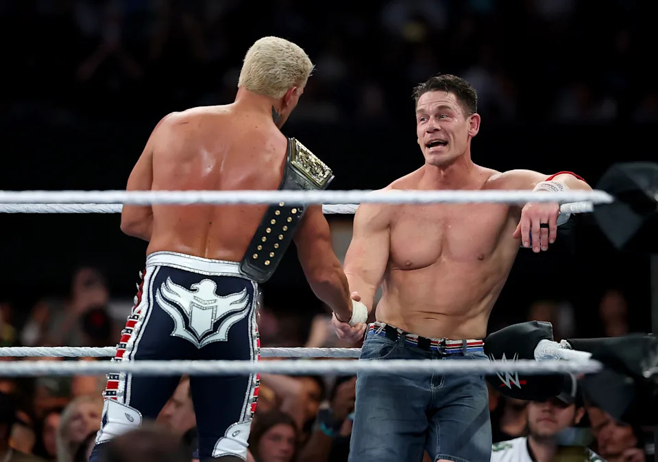 EAST RUTHERFORD, NEW JERSEY - AUGUST 03: Cody Rhodes celebrates John Cena after Rhodes defeated Cena in their match for the WWE Undisputed Championship during the WWE 2025 SummerSlam at MetLife Stadium on August 03, 2025 in East Rutherford, New Jersey. (Photo by Elsa/Getty Images)