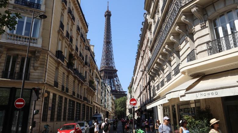 Looking down a street in Paris, with the Eiffel Tower in the background.