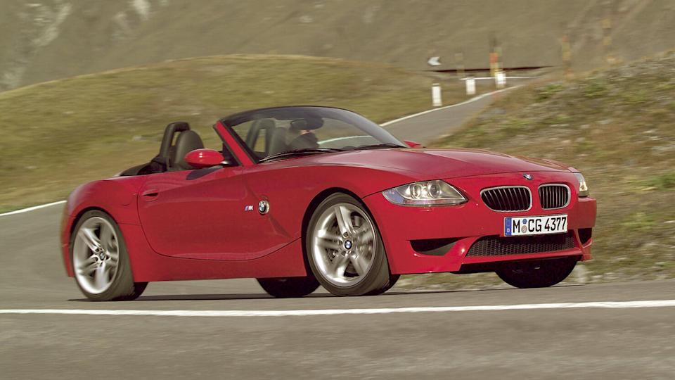 Red 2006 BMW Z4 M Roadster Driving With Roof Down Front 3/4 View