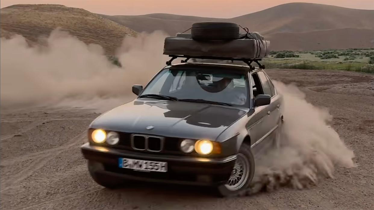BMW E34 doing donuts in the dirt