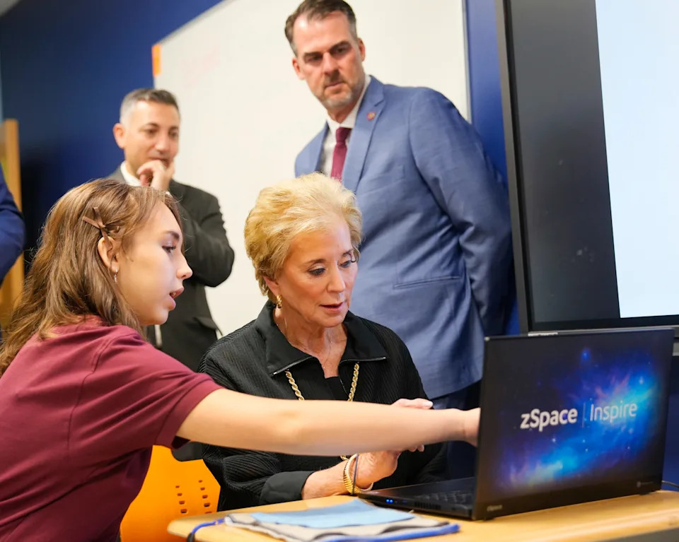 Dove Science Academy high school biology student Haylie Harrison shows a program Aug. 19 during a visit from U.S. Education Secretary Linda McMahon and Oklahoma Gov. Kevin Stitt.