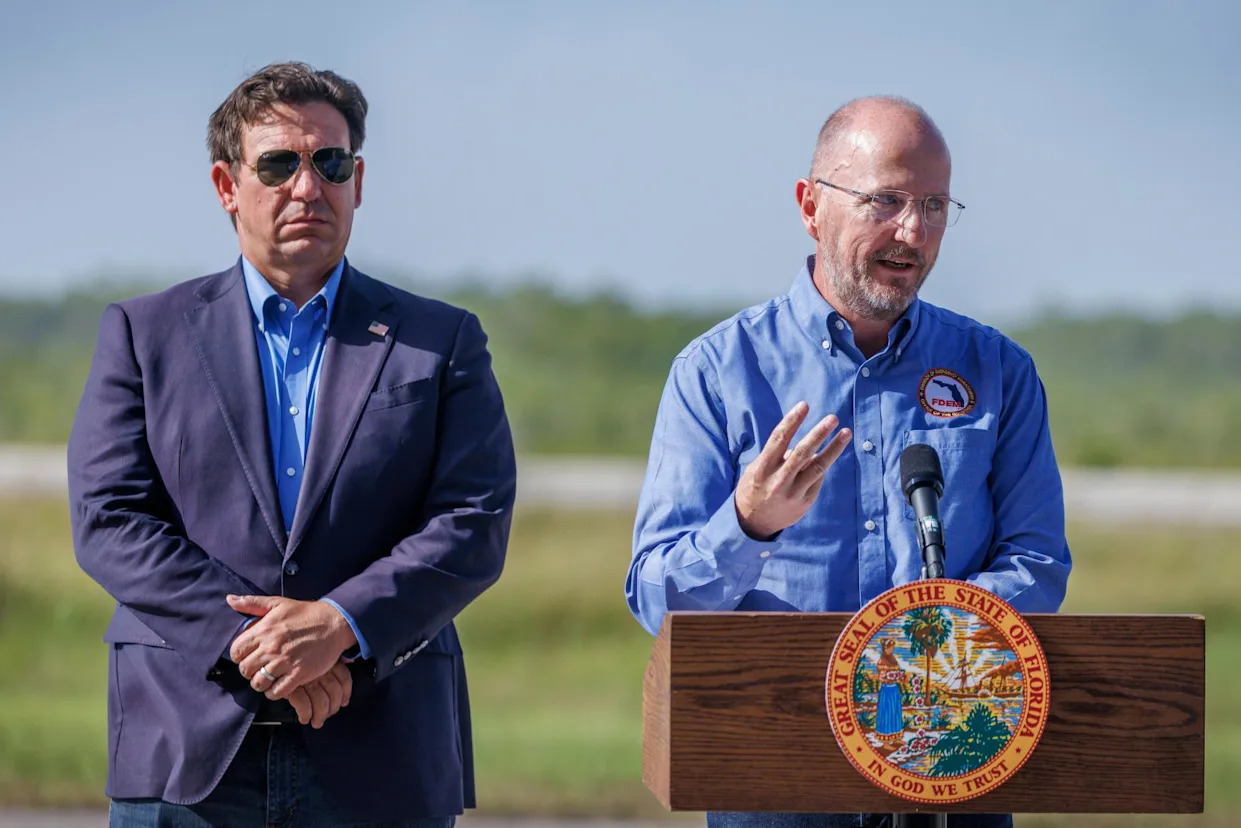 <span>Ron DeSantis and the head of Florida’s division of emergency management, Kevin Guthrie, hold a press conference on 25 July 2025.</span><span>Photograph: Cristóbal Herrera/EPA</span>