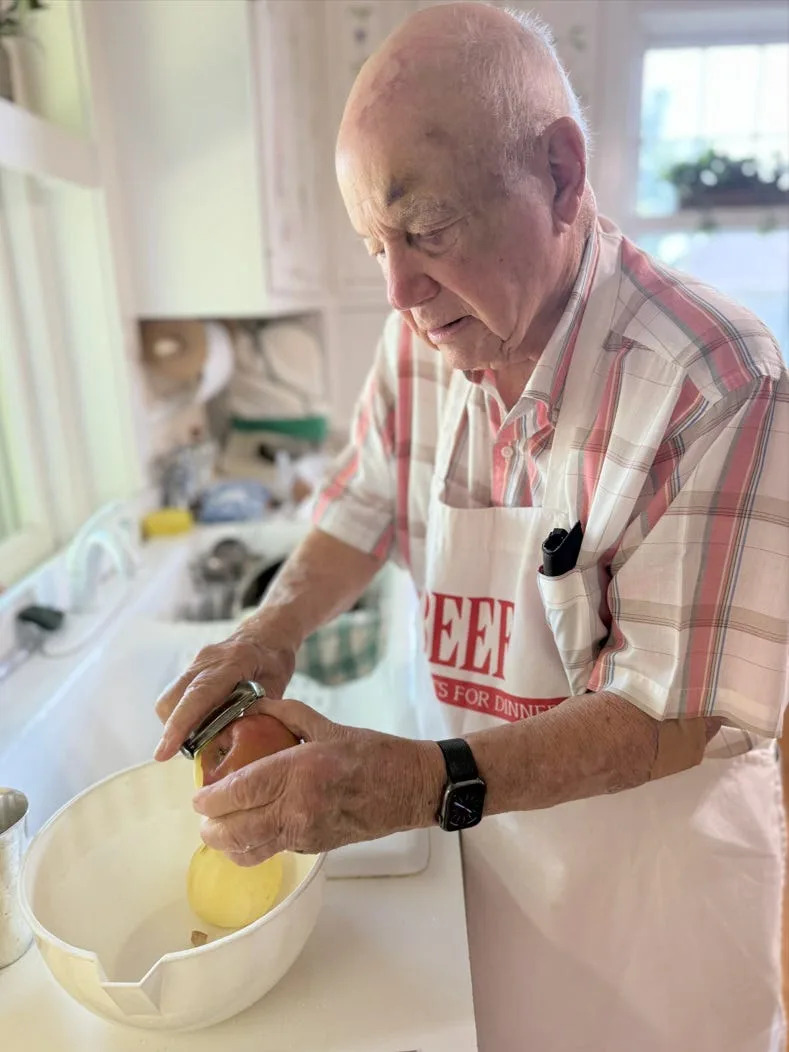 Bob Hall, 95, peels apples for an apple pie that he is entering in the 2025 Kentucky State Fair. Last year, Hall won a blue ribbon for his shortbread cookies, but his apple pie didn't place.