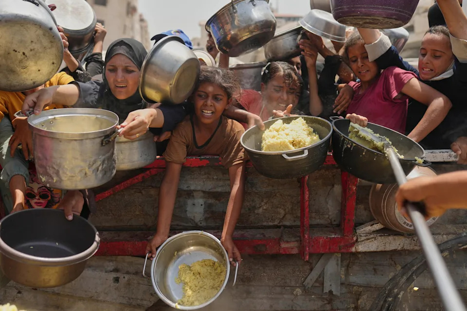 Palestinians struggle to get donated food at a community kitchen in Gaza City, northern Gaza Strip, Aug. 16, 2025. / Credit: Jehad Alshrafi/AP