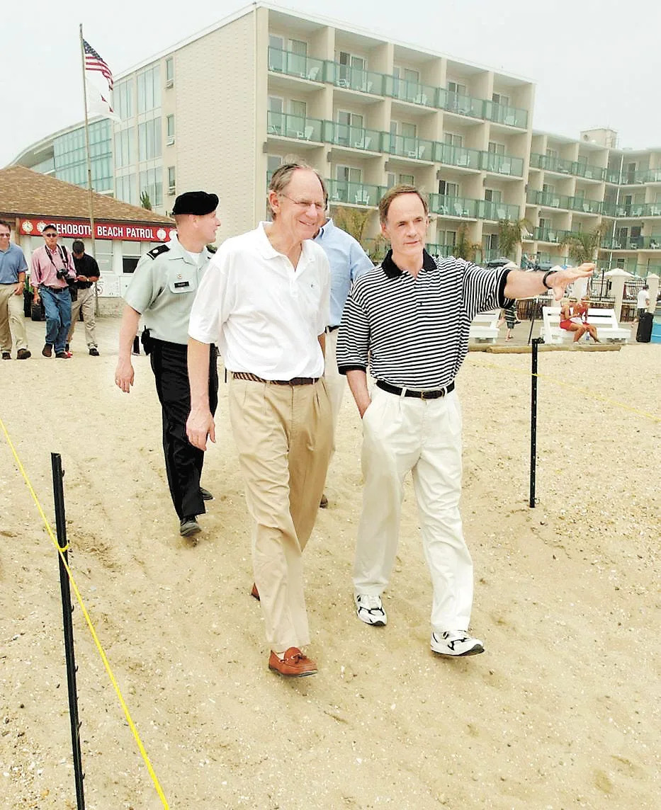 U,S. Rep. Mike Castle, left, and Sen. Tom Carper look over newly replaced sand at Rehoboth Beach on July 1, 2005.