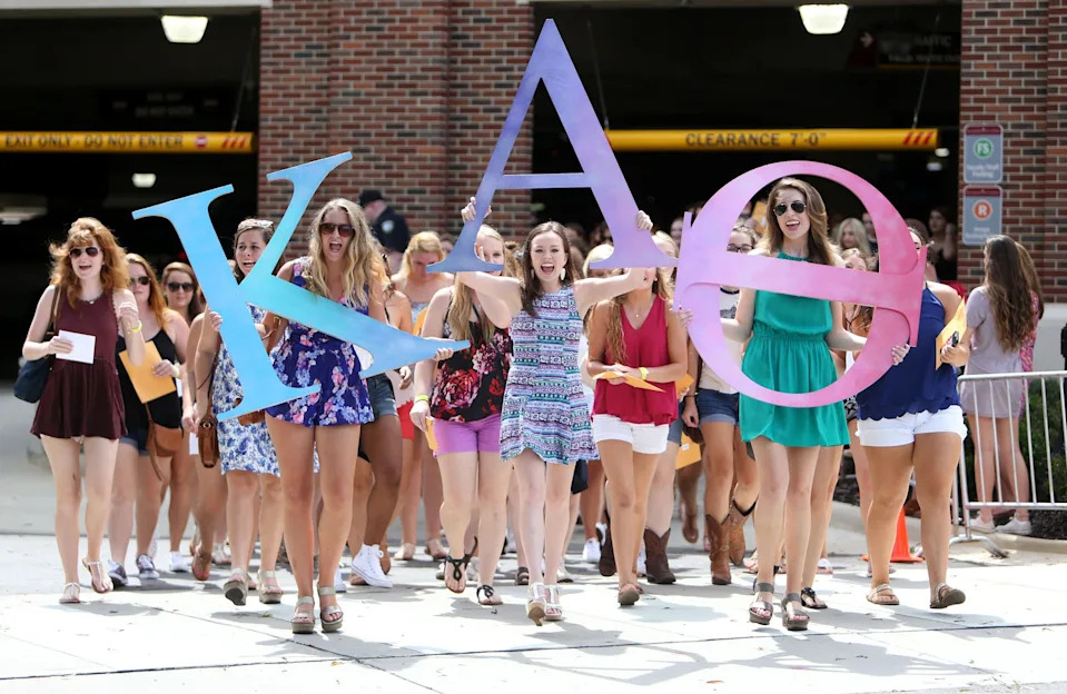 New sorority members run to the Kappa Alpha Theta house during the University of Alabama's Formal Sorority Recruitment Bid Day on Sorority Row in Tuscaloosa, Ala. on Saturday, Aug. 13, 2016. More than 2,600 students participated in recruitment, with the largest recruitment class in the nation, and 2,488 received bids from the 16 participating Panhellenic sororities.  Staff Photo/Erin Nelson