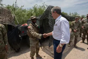 Gov. Jim Pillen on a 2024 visit to the Texas-Mexico border. He visits with members of the Nebraska National Guard, whom he deployed to help Texas patrol its border. (Courtesy of the Nebraska Governor’s Office)