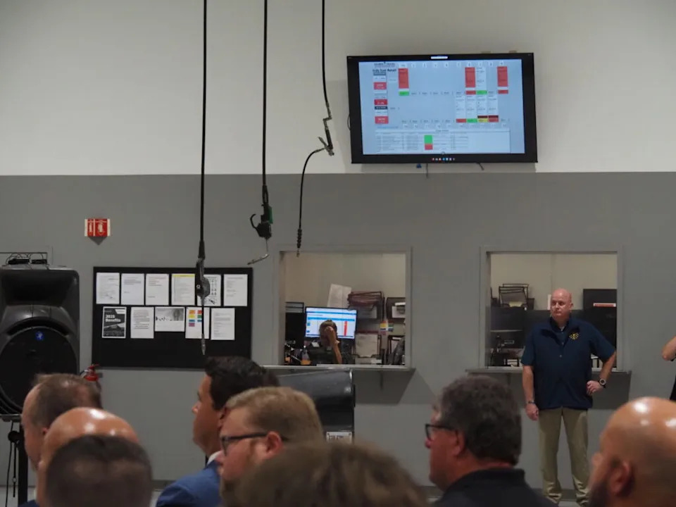 People attend a federal environmental deregulation announcement at an Indianapolis trucking facility on Tuesday, July 29, 2025. (Leslie Bonilla Muñiz/Indiana Capital Chronicle)