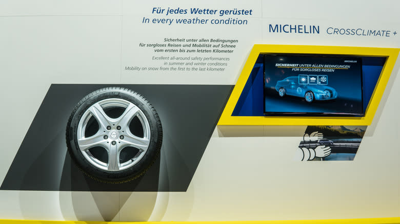 A Micheline CrossClimate+ tire on display at a Micheline booth.