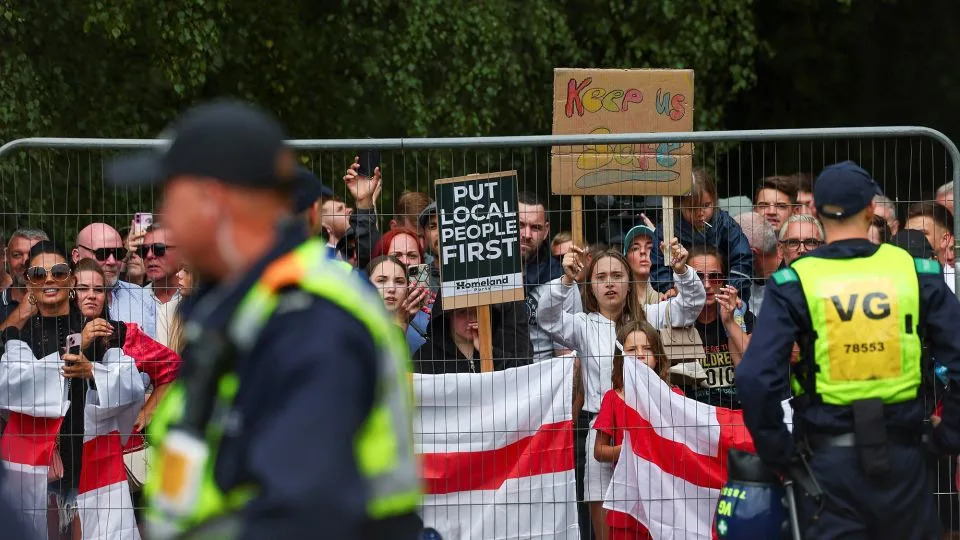 Protesters gathered outside the Bell Hotel in July. - Isabel Infantes/Reuters