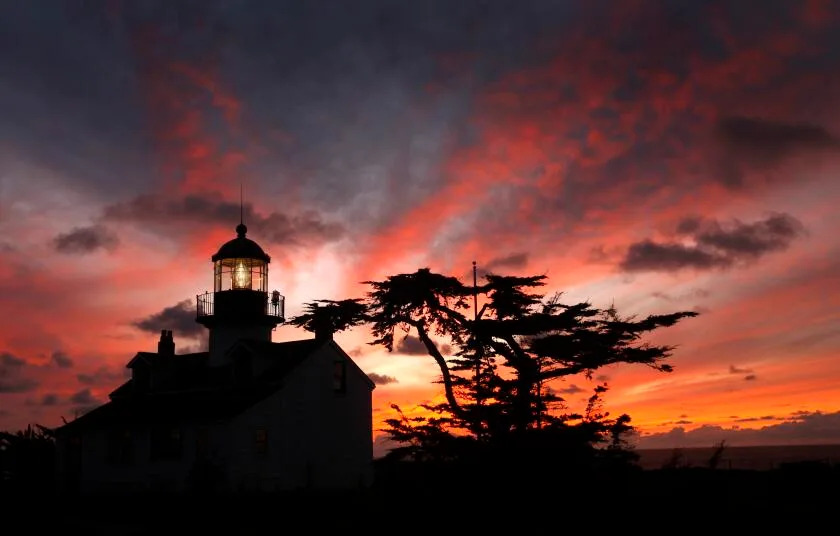 The sun sets behind the historic Point Pinos lighthouse in Pacific Grove, Calif., on Sunday, Feb. 20, 2011. The beacon has been guiding mariners sailing near the Monterey Peninsula&#39;s rugged coastline since 1855 and is the oldest continuously operating beacon on the west coast. For a suggested donation of $2, visitors can tour lighthouse Thursday through Monday from 1 p.m. to 4 p.m. (Photo By Paul Chinn/The San Francisco Chronicle via Getty Images)