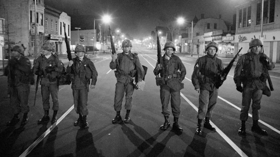Troops patrol a downtown street in Washington, DC, after President Johnson ordered them in to help police on April 5, 1968. - Bettmann Archive/Getty Images