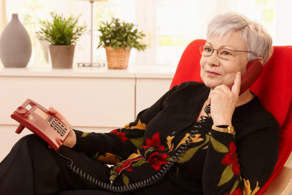 Boomer talking on a landline.