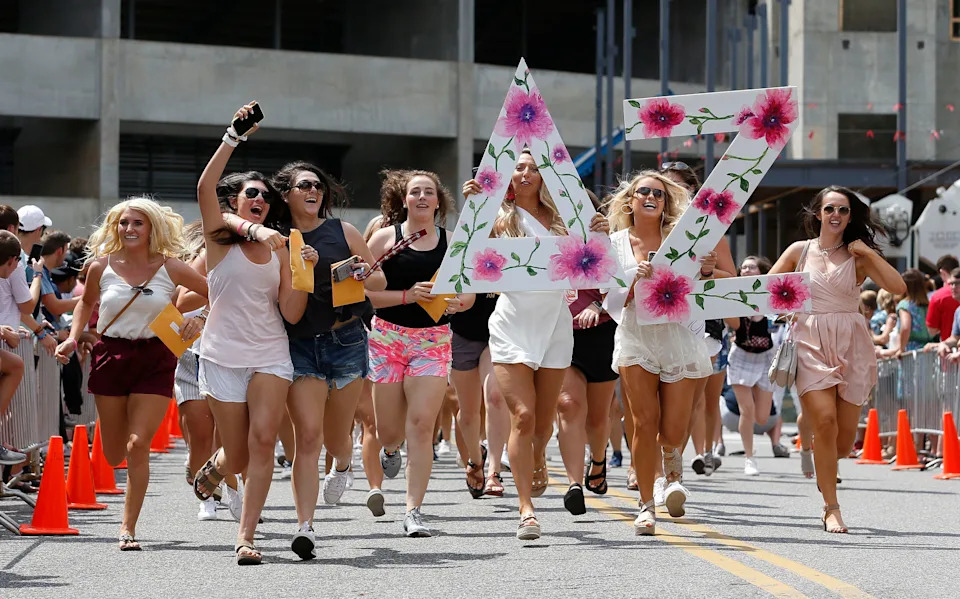 New sorority sisters join their sororities on Bid Day Sunday, August 19, 2018 on Sorority Row outside Bryant-Denny Stadium. New Delta Zeta members run down the street to their house. [Staff Photo/Gary Cosby Jr.]