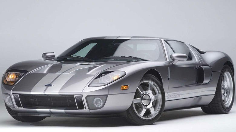 A silver Ford GT sitting in nondescript room