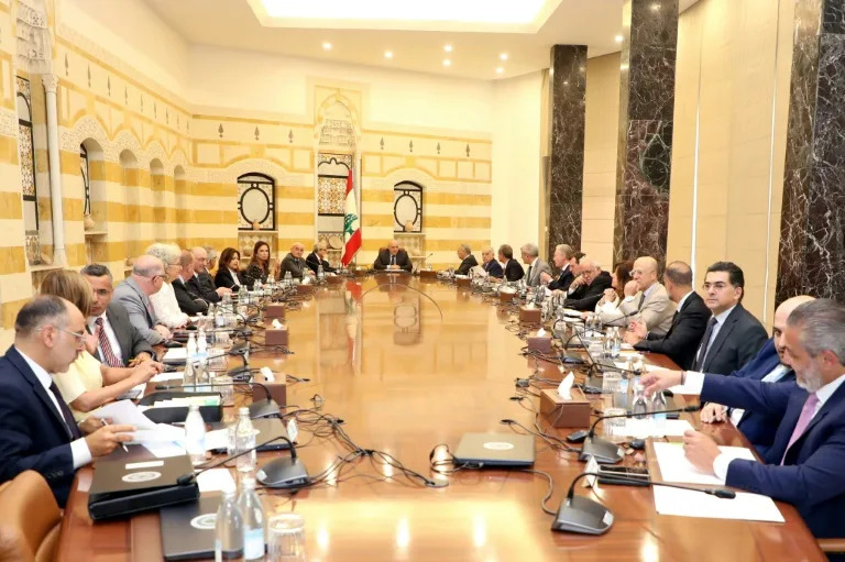 Lebanon's cabinet convened on Thursday to discuss disarming Hezbollah, which opposes the notion (-)