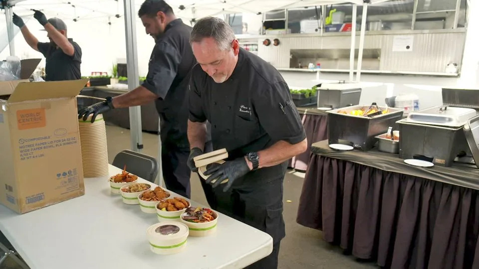Stephen Faust, Executive Chef for the TV series "Matlock," prepares meals for handoff to CNN Hero Hillary Cohen's Every Day Action. - CNN