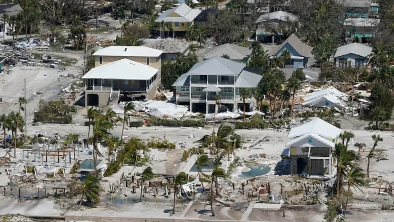 Damaged and missing homes are seen after Hurricane Ian hit Fort Myers Beach in 2022. &#xa9;Wilfredo Lee