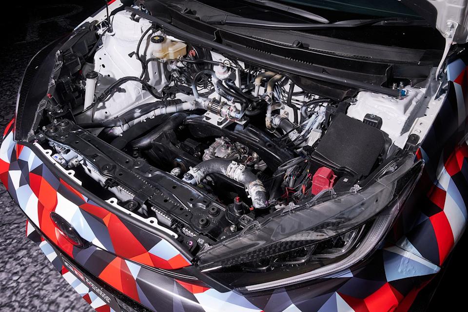 open car hood displaying engine components and wiring