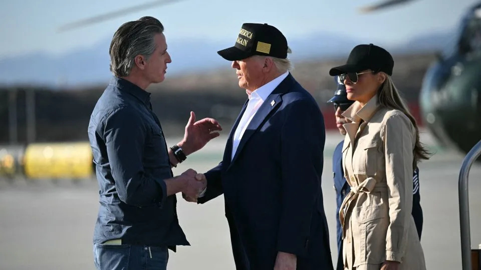 President Donald Trump, followed by first lady Melania Trump, shakes hands with California Gov. Gavin Newsom after arriving at Los Angeles International Airport in Los Angeles on January 24 to visit the region devastated by the Palisades and Eaton fires. - Mandel Ngan/AFP/Getty Images